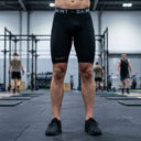 SA1NT LAYERS Men's P1 Elite Compression Shorts, worn in an indoor training hall