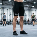 SA1NT LAYERS Men's P1 Race Compression Shorts, worn in an indoor training hall