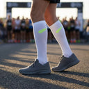 Runner wearing SA1NT LAYERS Compression Race Socks White Fluro Yellow at a race start line