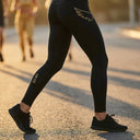 SA1NT LAYERS Women's P1 Elite Compression Tights, worn outdoors on a road run